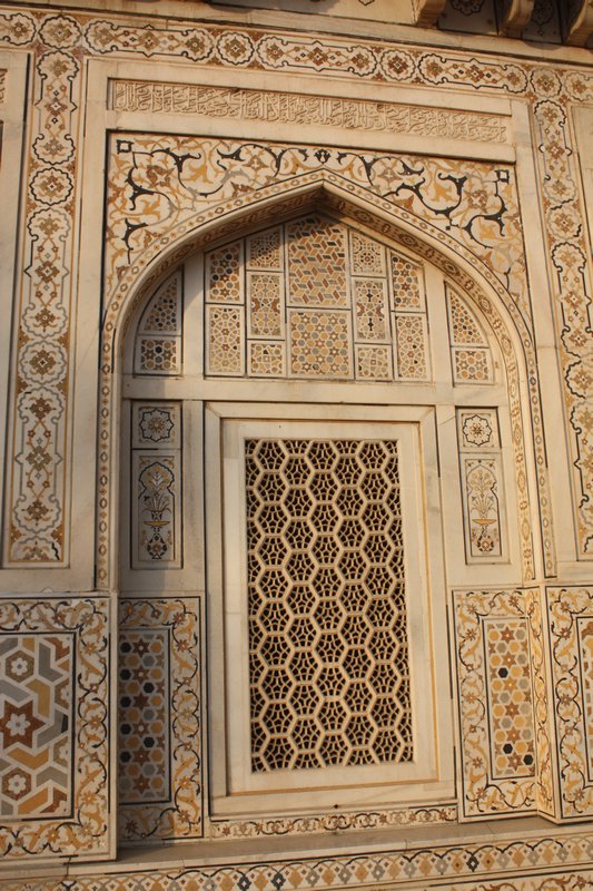 An intricately carved window arch