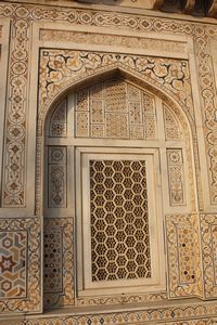 An intricately carved window arch
