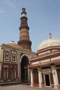Qutb Minar towers over these tombs