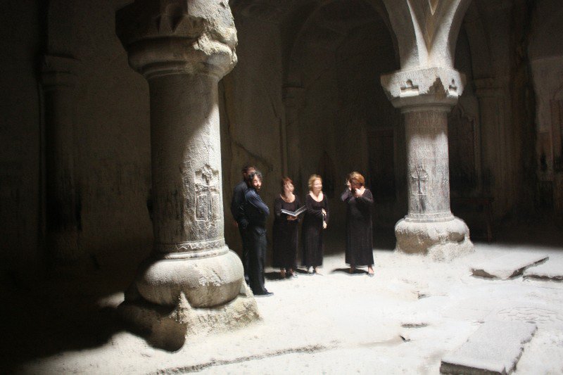 Choralists test acoustics of the upper church