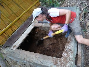 tarn getting right in to emptying out the composting toilet