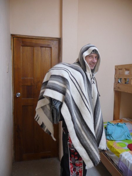 the hunchback of quilatoa gets ready for the 6 hour mountain trek to the next town