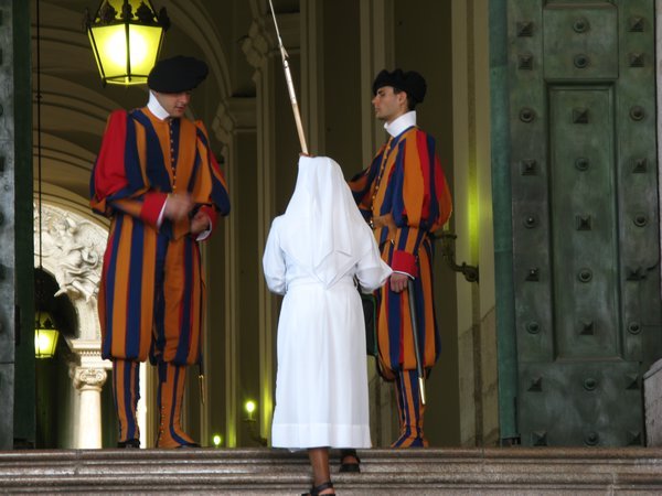 A nun checked by the Swiss Guards