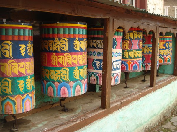 Prayer wheels inbedded in Mani wall