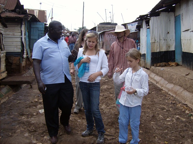A family walking in kibera slums