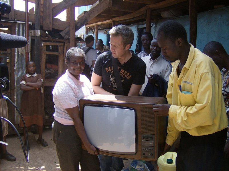 A film Producer donates a TV set to Tunza childrens centre in kibera