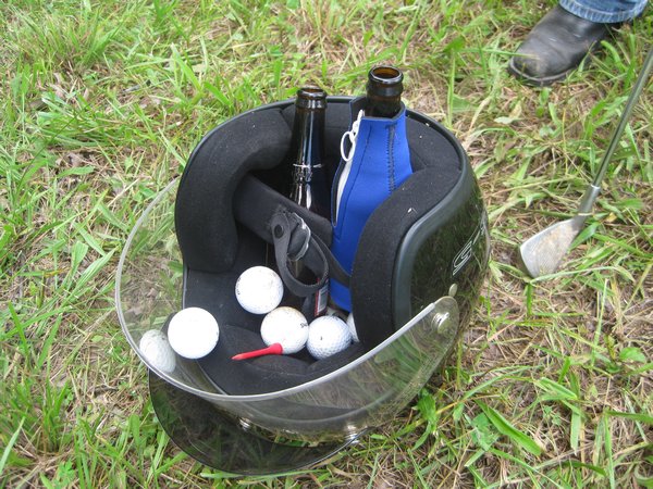 A Helmet Doubles as a Beer and Ball Bag