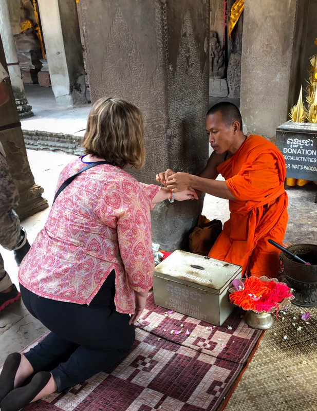 Receiving a Prayer From Buddhist Monks at Angkor Wat