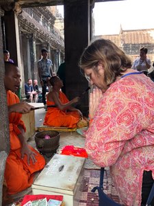 Receiving a Prayer From Buddhist Monks at Angkor Wat