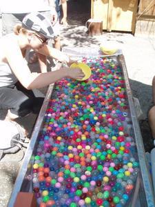 Amy scooping bouncy balls with a dissolvable net