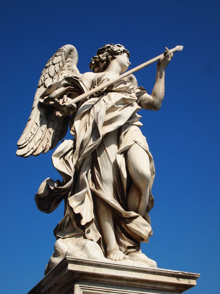 statue on the bridge looking over shoulder towards Vatican