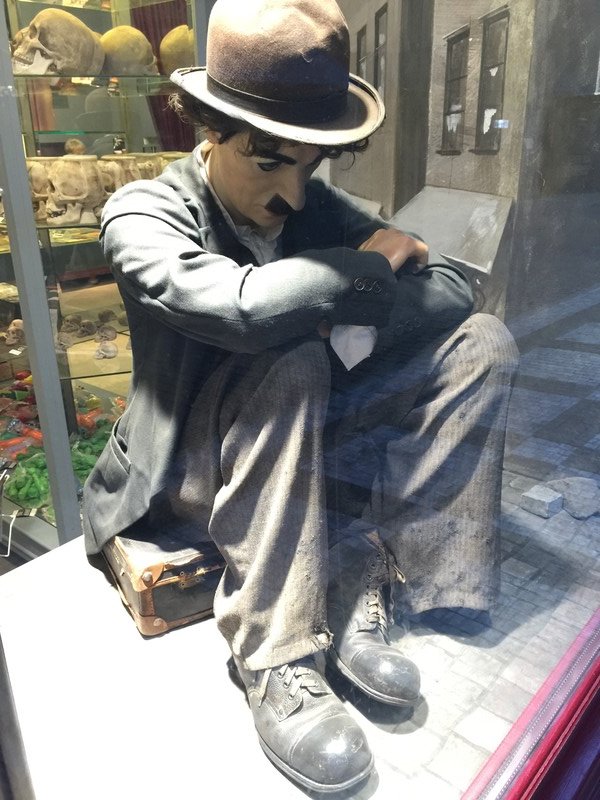 Good old Charley Chaplin sitting in the window of a store in Prague