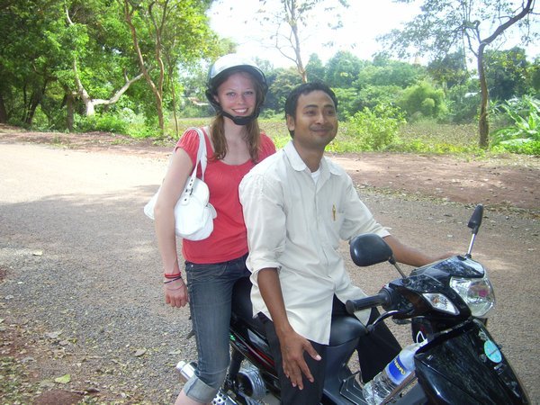 Me and my moto driver - check out the dodgy helmet I am wearing!