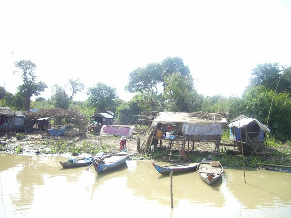 Floating houses and boats along the river