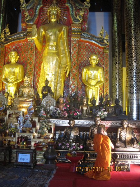 Monk praying in temple
