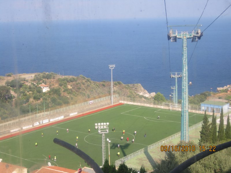 football ground suspended in the mountain