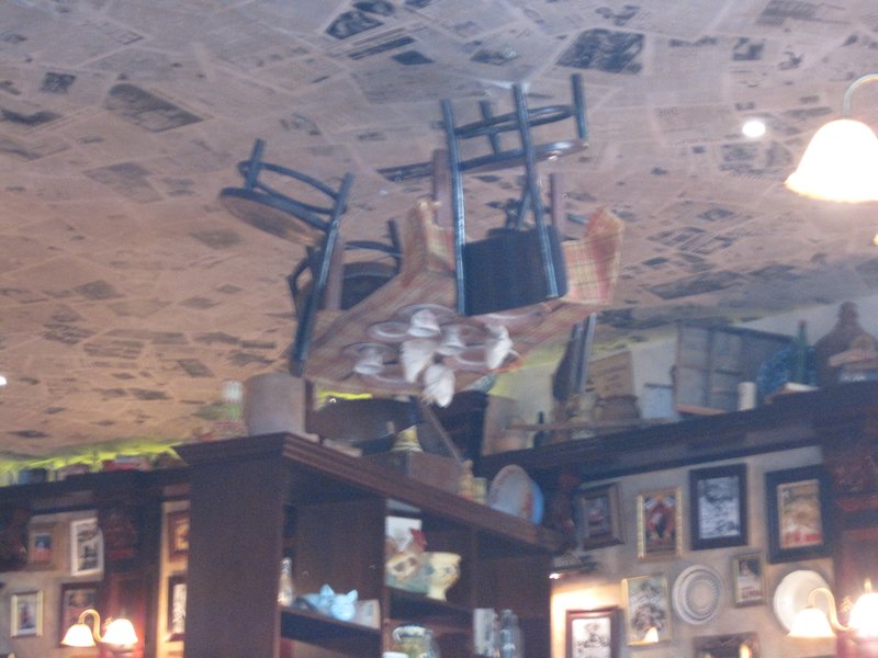 Cafe table and chairs on the ceiling