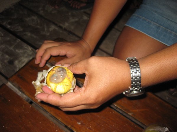 Eating Balut (duck egg with embryo)