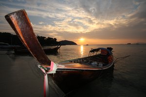 longtail boat & sunset