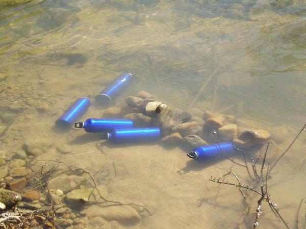 Our water cooling down in the river after boiling for consumption