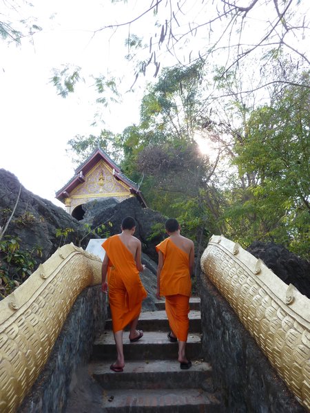 Monks walking the stairs of Phou Si hill in Luang Prabang