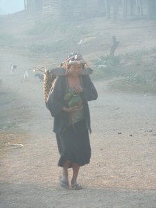 Akha woman going to work early in the morning