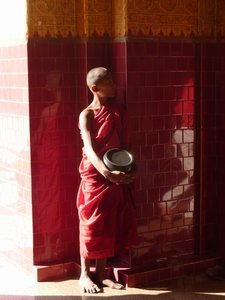 Monk staring at a ghost at Mahamuni Temple