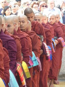 Monks standing in line to collect their food at Mahagandhayon Monastery