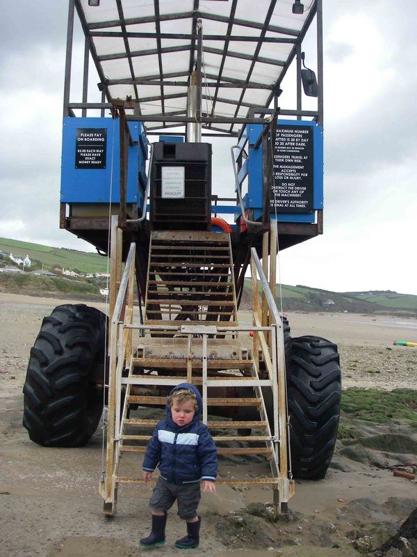 J stands in awe beneath the mighty sea tractor!