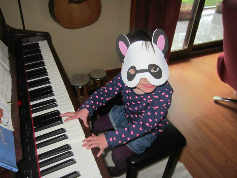 There's a panda on the piano!