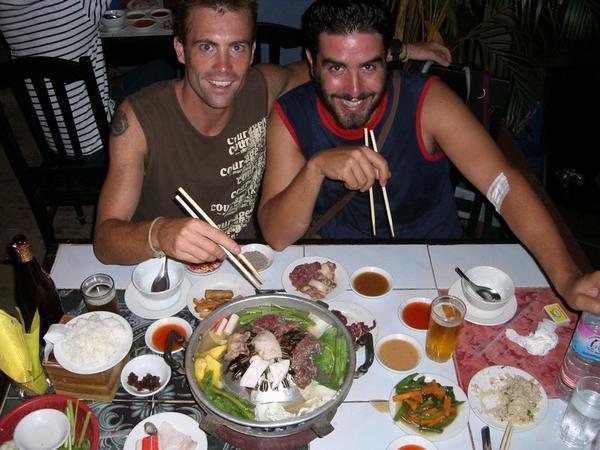 Matt and Steve in gastronomical heaven at a Cambodian BBQ 