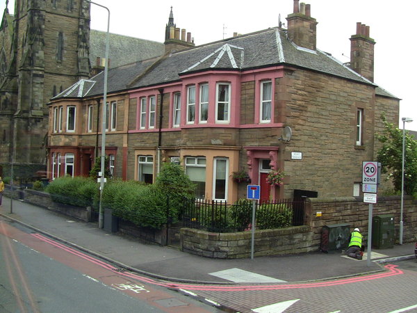 Typical Scottish row houses alongside a local church