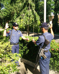 Policemen raising the flag