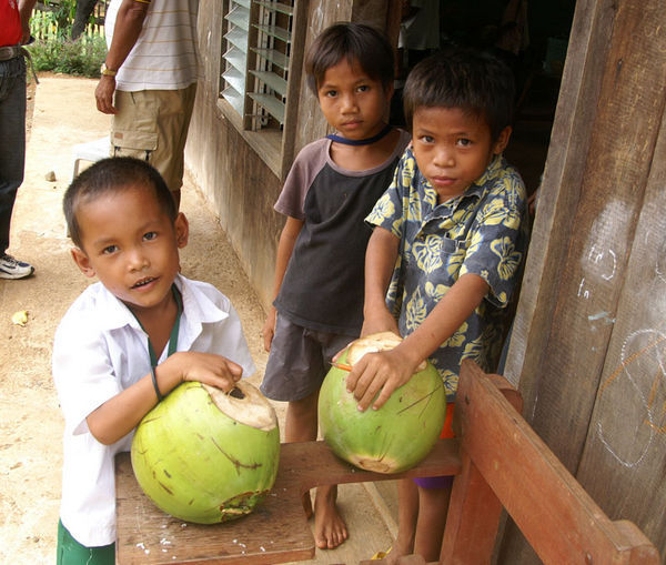 Kids with coconuts in Ibuan