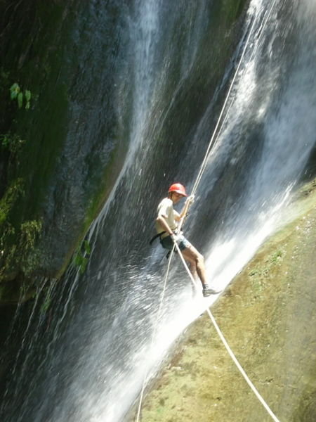 Absailing down a waterfall