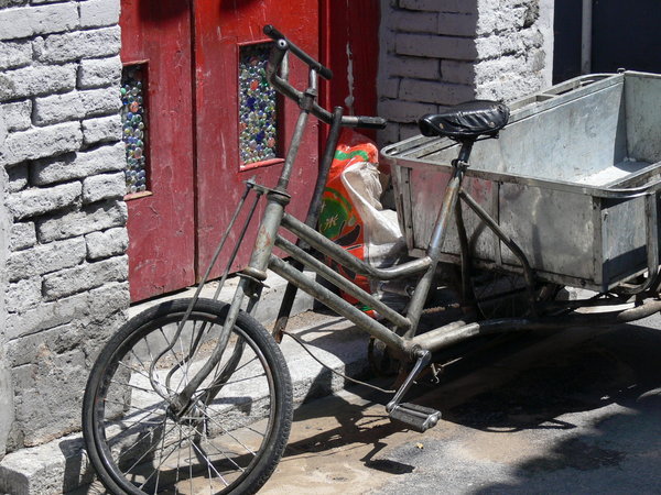 Trike in hutong doorway