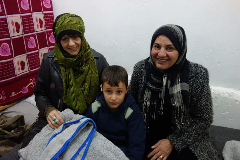 Giving clothes to a Syrian family