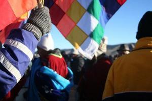 Bolivians raising the flag at Tiwanaku