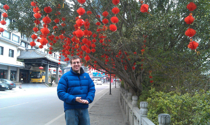 Dave surrounded by Red Chinese lanterns
