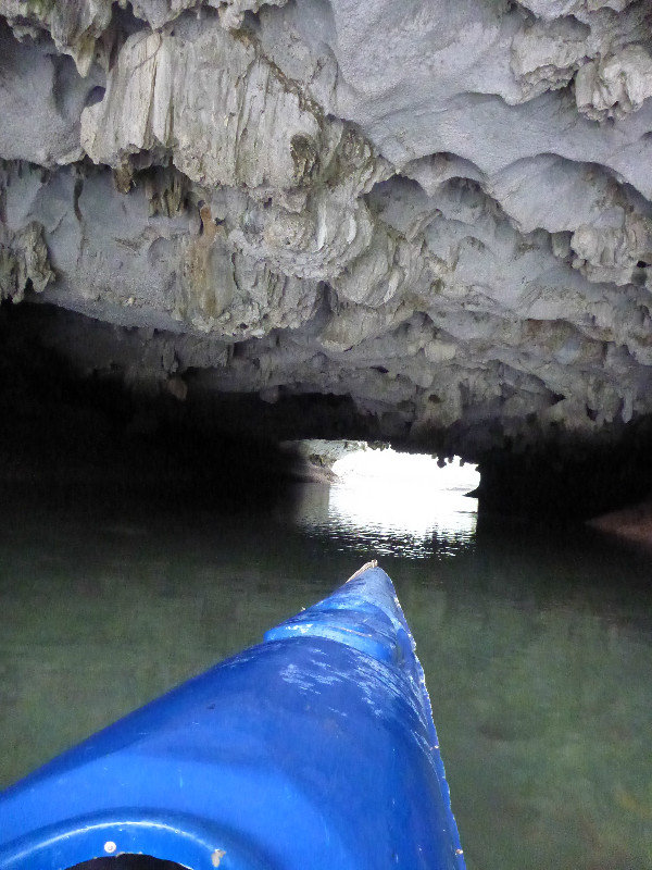 Kayaking through tunnels in Halong Bay