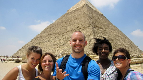 Travel group in front of the pyramids