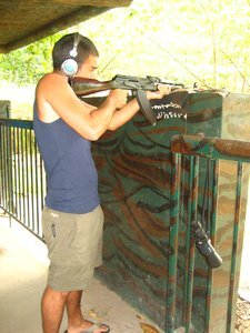 Paulo shoots an AK47