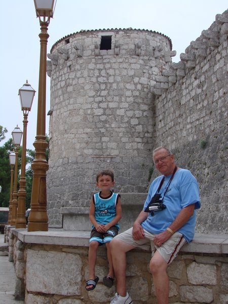 Ayden and Grandpa near the walls of Krk