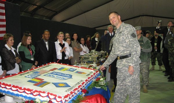 The General cutting that gigantic cake