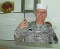 My boss (The Logistics Lieutenant Colonel) lending a helping hand behind the food service line 