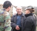 LMT soldier and interpreter talking with village man