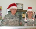 The Colonel and the Command Sergeant Major feeding the troops.  (Dobie got to help also!)