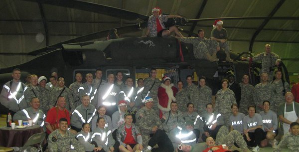 Soldiers and their special guest on the helicopter