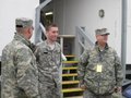Logistics leaders visit with soldier at the Greek camp