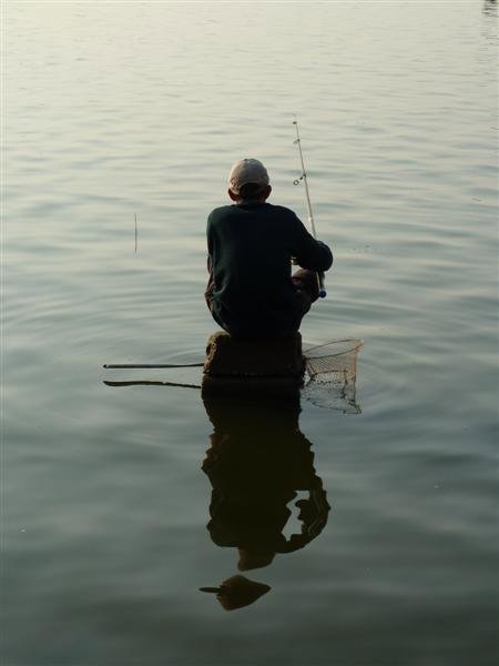 Man sitting on water...